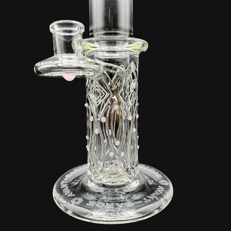 710 Pipes Avant-Garde clear glass water pipe with pink accents and intricate detailing. Features a wide base for stability.
