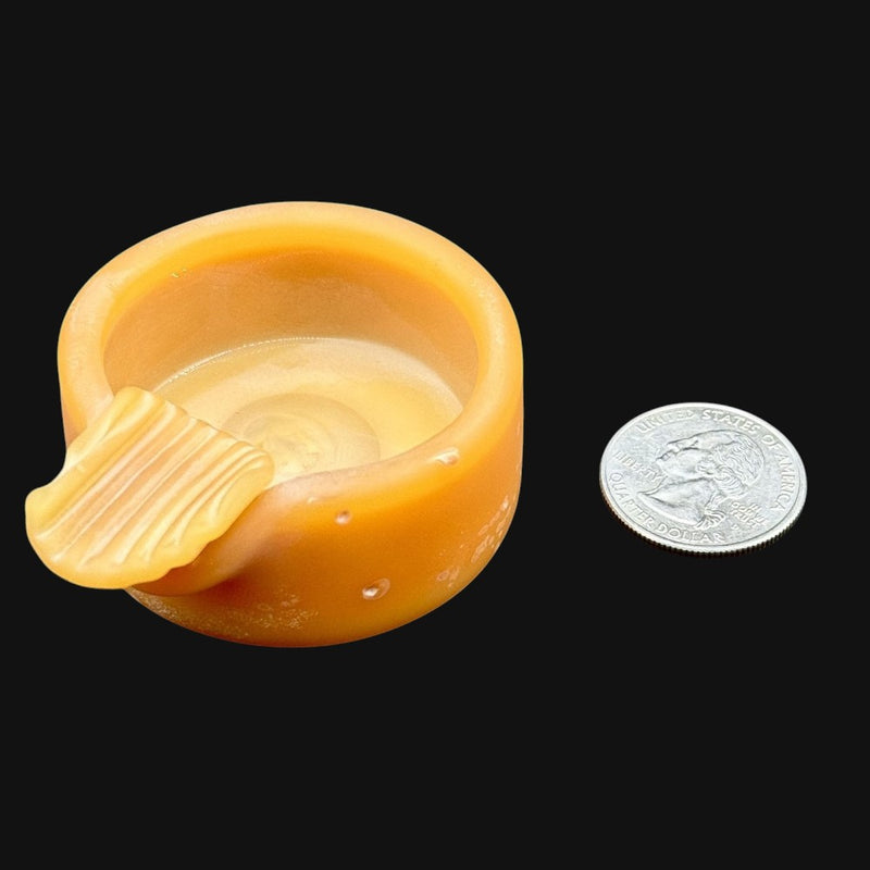 710 Pipes Smoke Shop AlecBlowsGlass small yellow glass ash tray with a ribbed rest next to a US quarter coin
