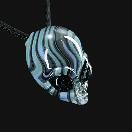 710 Pipes Smoke Shop Ghost Glass alien head pendant with blue and black swirled glass and glittery dark eyes.