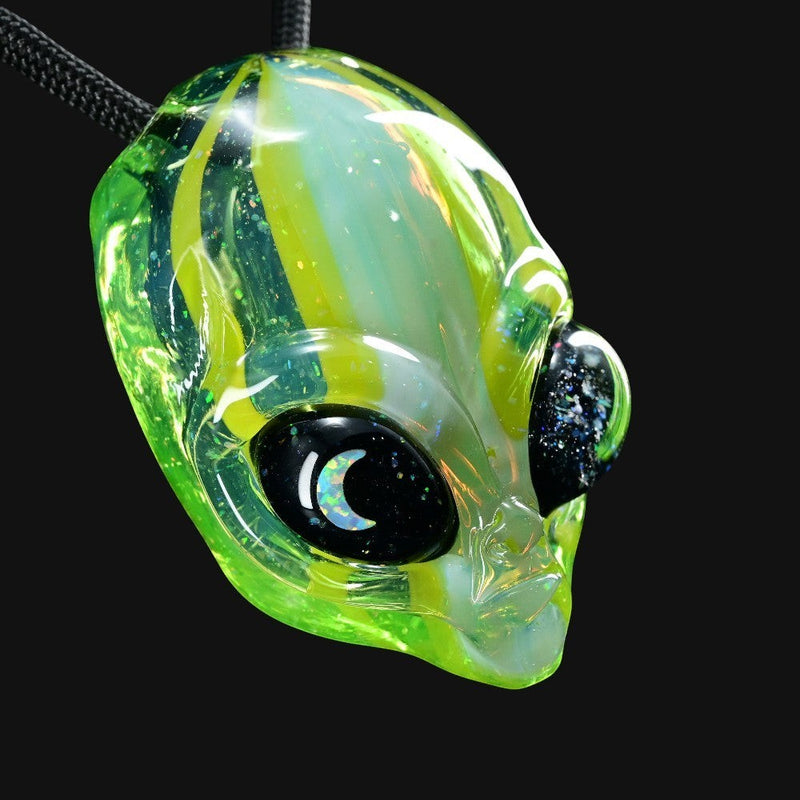 710 Pipes Smoke Shop Ghost Glass alien head pendant in green glass with a moon opal eye on a black cord necklace.
