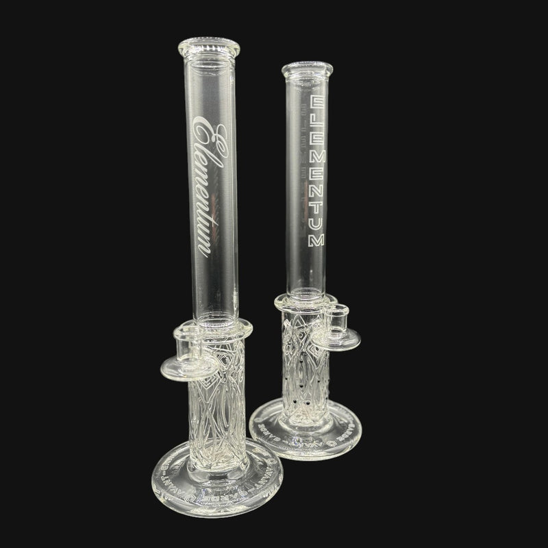 710 Pipes Smoke Shop Avant-Garde clear glass tube with intricate etched design and "Elementum" logo.