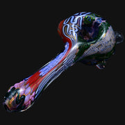 710 Pipes Smoke Shop thick glass spoon pipe featuring intricate Batman-themed multi-colored patterns and textures.