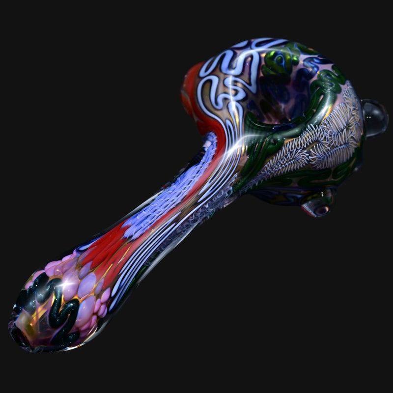 710 Pipes Smoke Shop thick glass spoon pipe featuring intricate Batman-themed multi-colored patterns and textures.