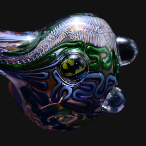 710 Pipes Smoke Shop Matty White 2 Milli ISO glass spoon pipe featuring intricate Batman logo and colorful patterns