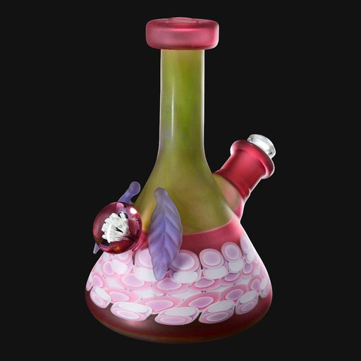 710 Pipes Smoke Shop mini dotstack beaker, 6.5 inches tall, with a marble and leaf detail. Green neck, red accents, and pink/white dot pattern.