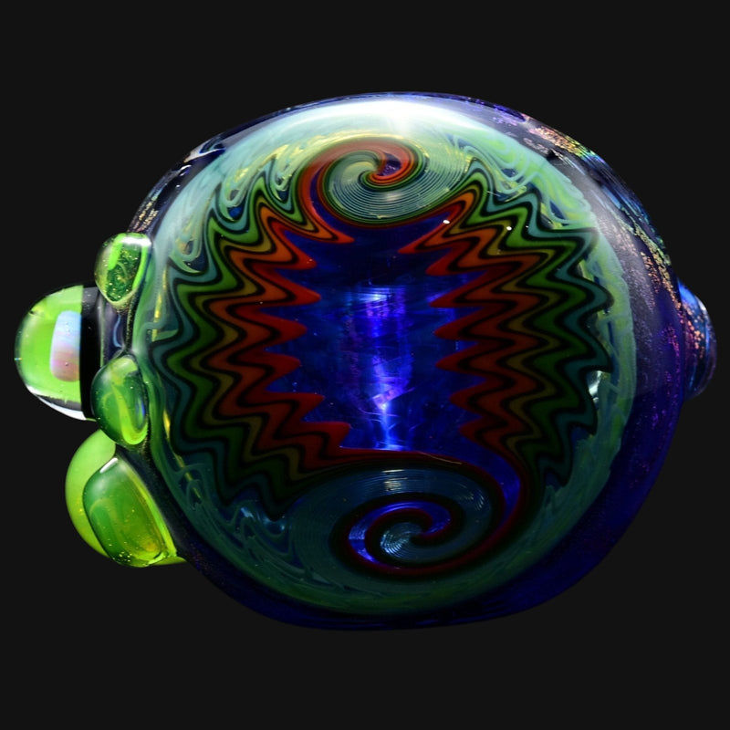 710 Pipes Smoke Shop Blossom Dichro Spoon with blue, green, and red zig-zag pattern and green glass accents.