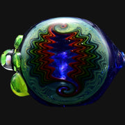 710 Pipes Smoke Shop blue glass spoon pipe with green accents and a colorful dichroic swirl pattern.