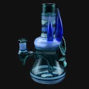 710 Pipes Smoke Shop blue glass rig with intricate blue glass accents and a leaf design.