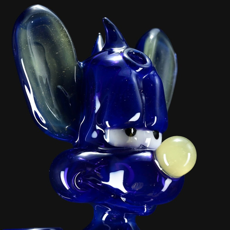 710 Pipes Smoke Shop blue glass water pipe shaped like a cartoon character with yellow nose and white accents.