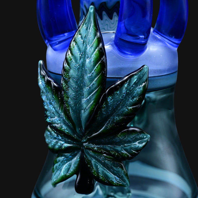 710 Pipes Smoke Shop blue glass water pipe with a green leaf accent and blue accents