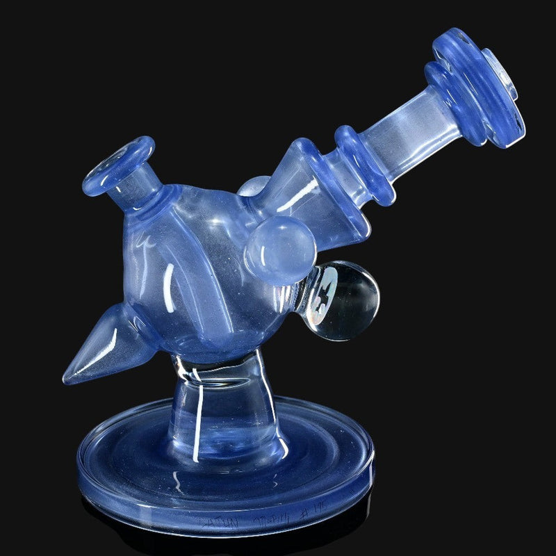 710 Pipes Smoke Shop Cajun X Marni Heliosphere rig in blue satin glass with encased opal marble detail. Stands 7 inches tall.