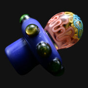 710 Pipes Smoke Shop Charisma Slurper Cap featuring a blue base with green glass marbles and a colorful patterned top.