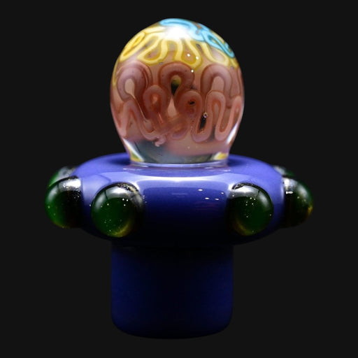 710 Pipes Smoke Shop Charisma Slurper Cap with a purple base, green glass accents, and a swirl-patterned dome top.