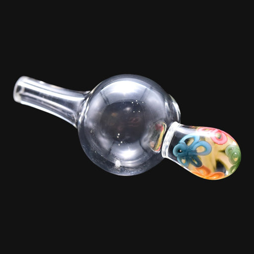 710 Pipes Smoke Shop clear glass bubble cap with a decorative floral pattern handle for dabbing accessories.