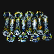 710 Pipes Smoke Shop Schutz glass spoon pipes featuring gold and silver fume swirls over deep cobalt blue glass.