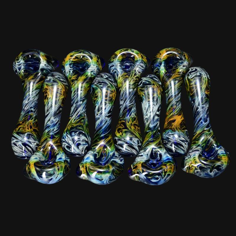 710 Pipes Smoke Shop Schutz glass spoon pipes featuring gold and silver fume swirls over deep cobalt blue glass.