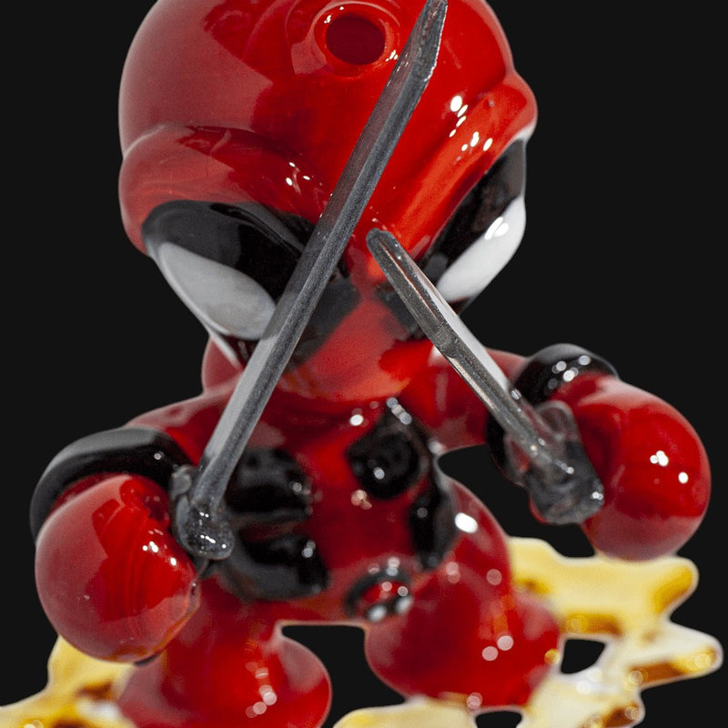 710 Pipes Smoke Shop Dani Girl Glass Deadpool dab tool with removable swords, red and black glass, 5 inches tall.