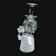 710 Pipes Smoke Shop Avant-Garde Deco Orb Fila Peak Top #2 on a white Puffco Peak with intricate glass filigree design.