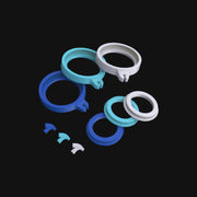 710 Pipes Smoke Shop Dr. Dabber Switch silicone accessory pack in blue, light blue, and white rings and caps.