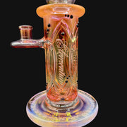 710 Pipes Smoke Shop Avant-Garde Fumed Elementum Columnar rig with black accent dots and intricate detailing. Orange-pink iridescent glass.