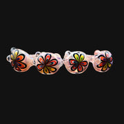 710 Pipes Smoke Shop glass spoon pipe featuring iridescent finish and colorful hand-blown flower patterns