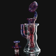 710 Pipes Smoke Shop clear glass incycler dab rig with red and blue accents and matching spinner cap.
