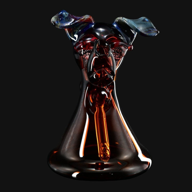 710 Pipes Smoke Shop T_Tree Glass Ruffer dog-shaped glass jammer pipe with deep red and blue accents.