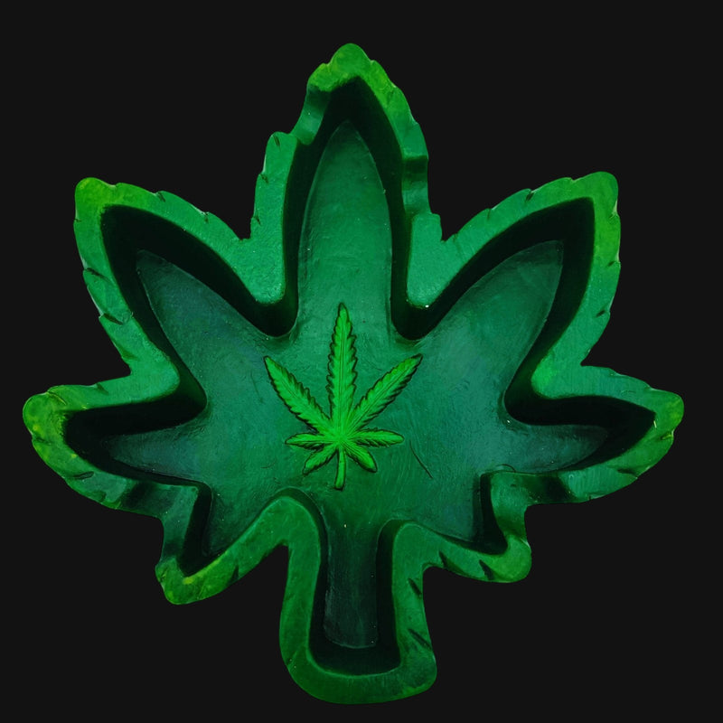 710 Pipes Smoke Shop green hemp leaf shaped ashtray with a detailed cannabis leaf emblem in the center