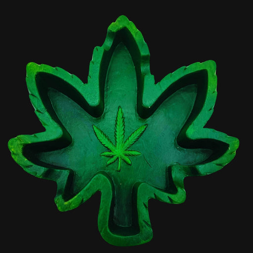 710 Pipes Smoke Shop green hemp leaf shaped ashtray with a detailed cannabis leaf emblem in the center