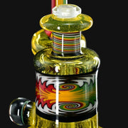 710 Pipes Smoke Shop Hedman Headies worked full terps rig with yellow glass and colorful swirl design.
