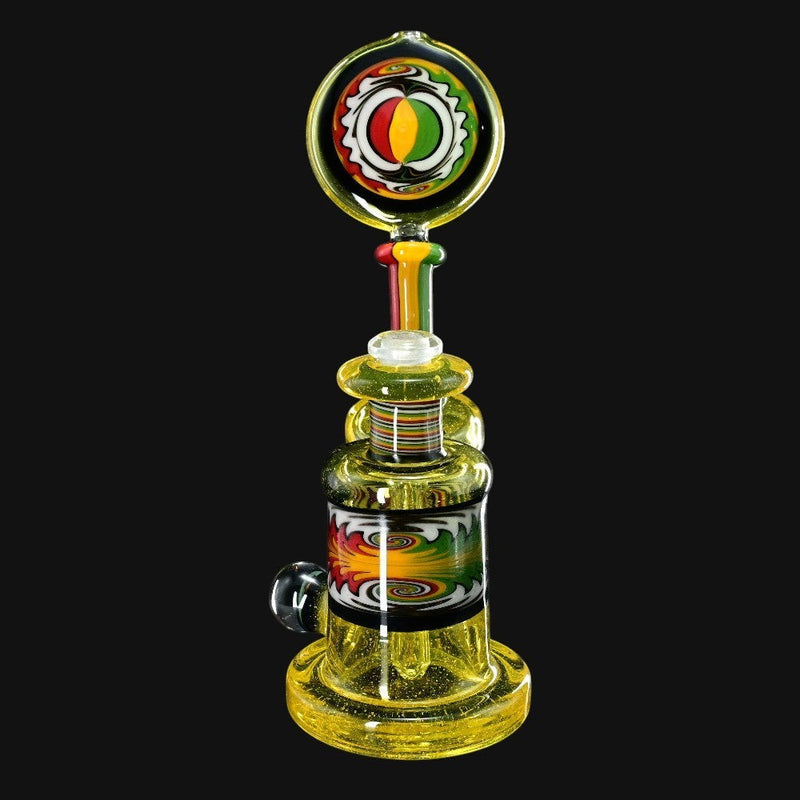 710 Pipes Smoke Shop Hedman Headies worked full terps rig, yellow glass with Rasta-colored accents.