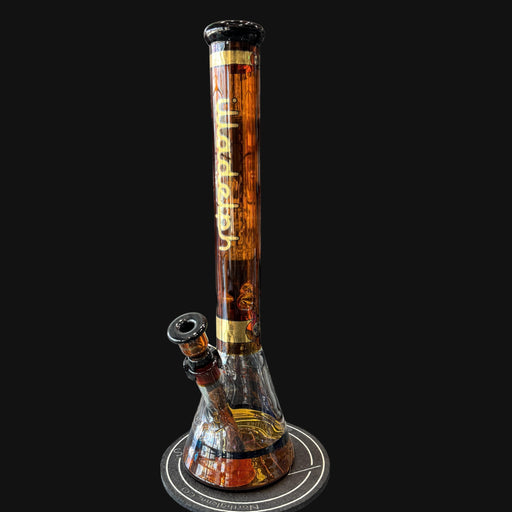 710 Pipes Smoke Shop Illadelph Premium Beaker with gold accents and amber glass.