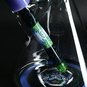 710 Pipes Smoke Shop Illadelph custom glass beaker bong with green and purple wigwag patterns and glitter accents
