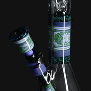 710 Pipes Smoke Shop Illadelph custom beaker bong with green and purple wigwag glass patterns and glitter accents.
