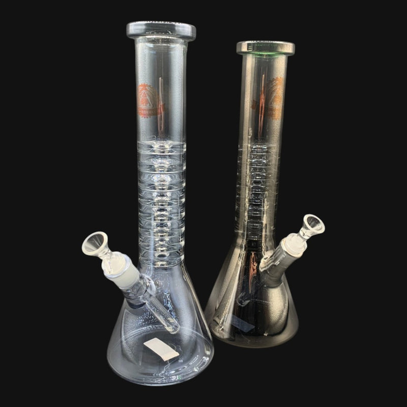 Two 710 Pipes Smoke Shop Illuminati Glass 15-inch clear borosilicate beaker bongs with ice pinches and downstems.