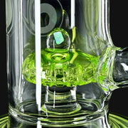 710 Pipes Smoke Shop Joel Halen Illuminati glass dab rig featuring a vibrant green percolator with an embedded opal.