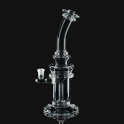710 Pipes Smoke Shop Kadabra 10mm clear glass dab rig with a curved neck and stable base on a black background.
