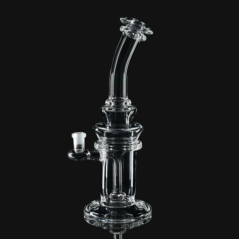 710 Pipes Smoke Shop Kadabra 10mm clear glass dab rig with a curved neck and stable base on a black background.