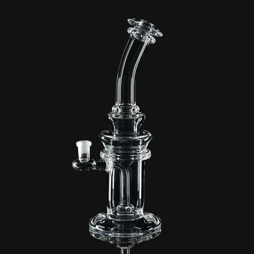 710 Pipes Smoke Shop Kadabra 10mm clear glass dab rig with a curved neck and stable base on a black background.