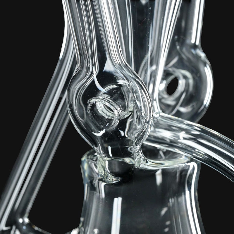 710 Pipes Smoke Shop Kadabra 6-inch glass doughnut recycler rig with clear and purple accents and 10mm joint.