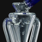 710 Pipes Smoke Shop Kadabra Floater Recycler glass rig with clear body and blue accents.