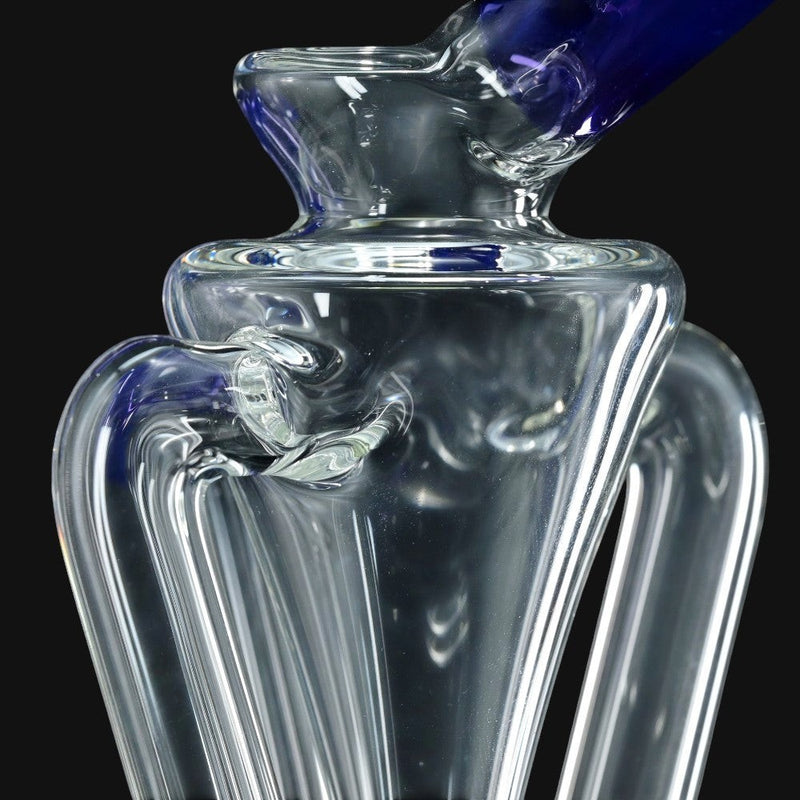 710 Pipes Smoke Shop Kadabra Floater Recycler glass rig with clear body and blue accents.