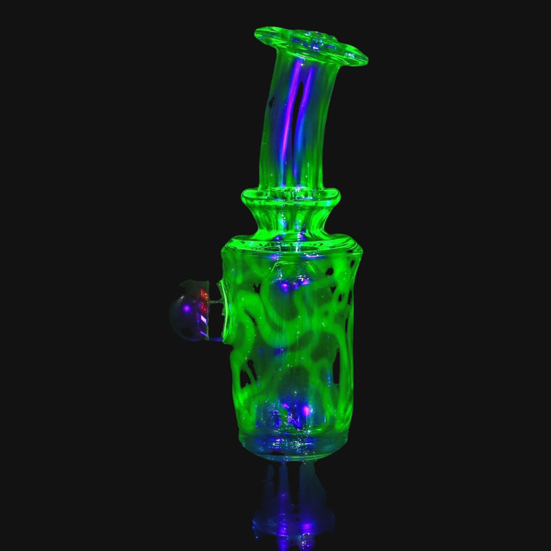 710 Pipes Smoke Shop Kadabra Ghost2 glass bubbler featuring vibrant UV reactive green glow and intricate milli design.