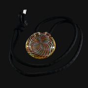 710 Pipes Smoke Shop Kadabra glass pendant with yellow, orange, and white swirl design on black cord.