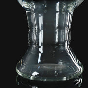 710 Pipes Smoke Shop locally made clear glass pint glass with a flared base design on a black background.