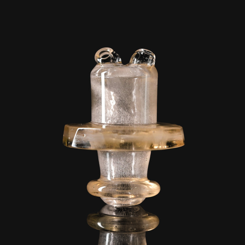 710 Pipes Smoke Shop Kadabra Switch2 faceted glass spinner cap in orange shimmer with a unique airflow design.