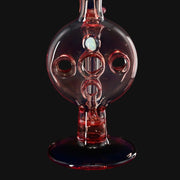 710 Pipes Smoke Shop Kadabra Swiss rig in Purple Rain glass with intricate percolator holes and an embedded opal.