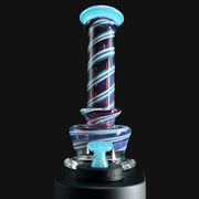 710 Pipes Smoke Shop Kadabra Switch2 glass rig with purple and blue spiral stripes and a light blue mouthpiece.