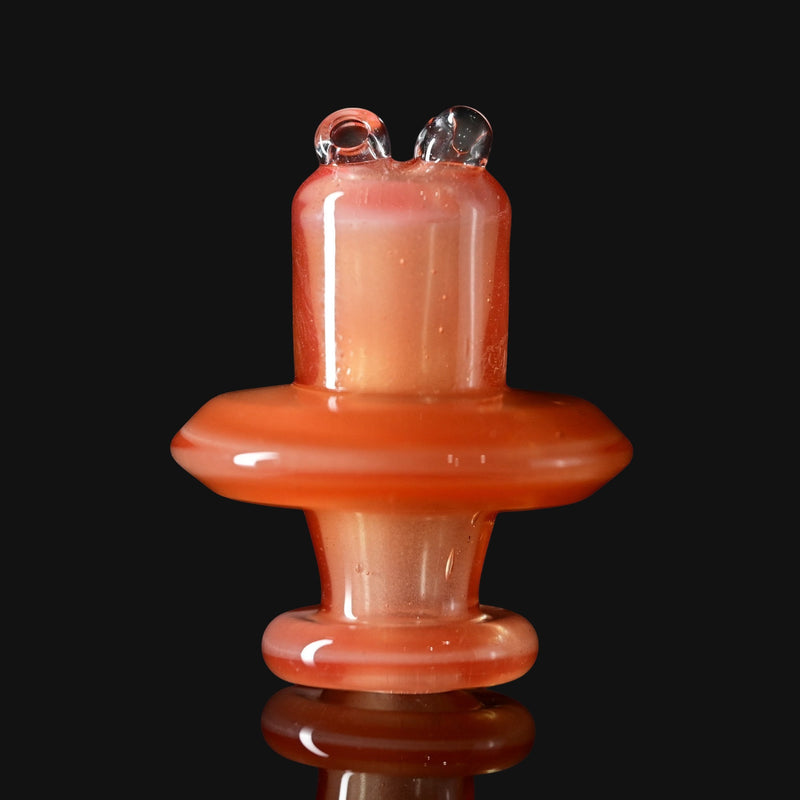 710 Pipes Smoke Shop Kadabra Switch2 spinner cap in orange shimmer glass with a unique dual-top airflow design.