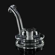 Clear glass Kadabra Terp Taster pipe by 710 Pipes Smoke Shop featuring a curved mouthpiece and wide base.